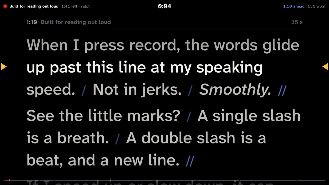 The teleprompter: large text scrolling past amber reading-line markers with pause marks.